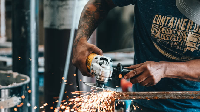 Man using angle grinder