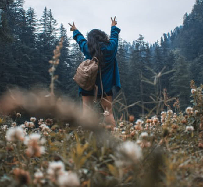 Woman standing in a forest