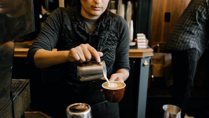 Barista making coffee drink